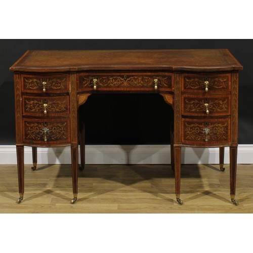 2562 - A Sheraton Revival satinwood crossbanded mahogany and marquetry inverted shaped serpentine desk, by ... 