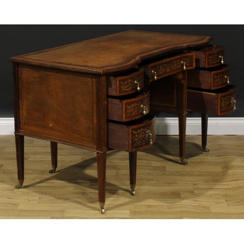 2562 - A Sheraton Revival satinwood crossbanded mahogany and marquetry inverted shaped serpentine desk, by ... 