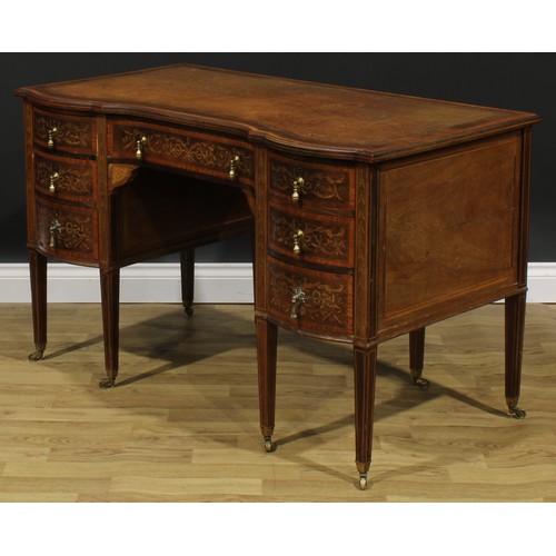 2562 - A Sheraton Revival satinwood crossbanded mahogany and marquetry inverted shaped serpentine desk, by ... 