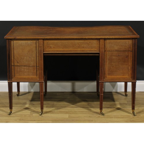 2562 - A Sheraton Revival satinwood crossbanded mahogany and marquetry inverted shaped serpentine desk, by ... 