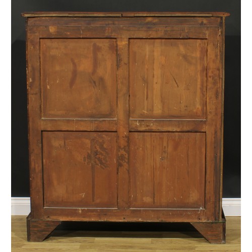 1634 - A 19th century mahogany low library bookcase, oversailing top above a pair of glazed doors enclosing... 