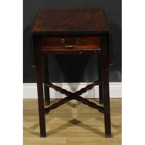 2461 - A George III mahogany Pembroke table, rounded rectangular top with fall leaves above a single frieze... 