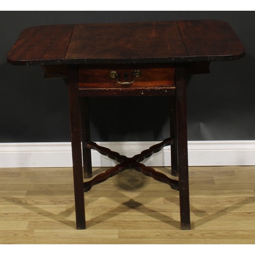 2461 - A George III mahogany Pembroke table, rounded rectangular top with fall leaves above a single frieze... 