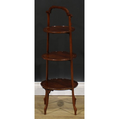 2255 - A Sheraton Revival mahogany three-tier cake stand, dished circular plateaux, outlined throughout wit... 