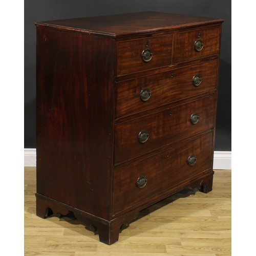 2483 - A George IV mahogany chest, slightly oversailing top above two short and three long graduated cockbe... 