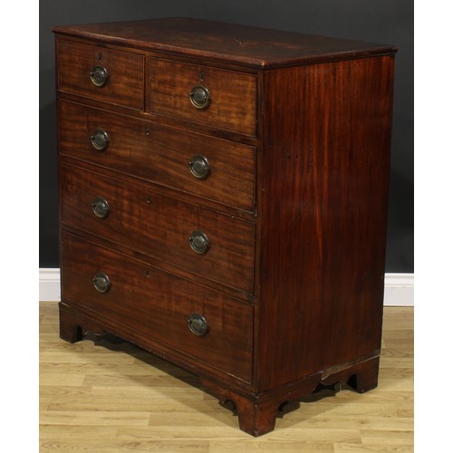 2483 - A George IV mahogany chest, slightly oversailing top above two short and three long graduated cockbe... 