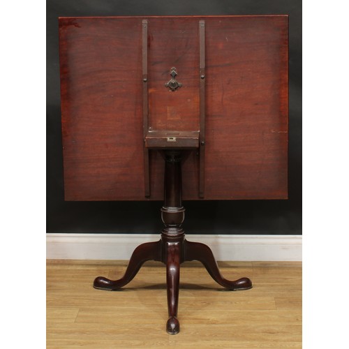 1743 - A George III mahogany tripod supper table, one-piece rectangular tilting top, turned column, cabriol... 