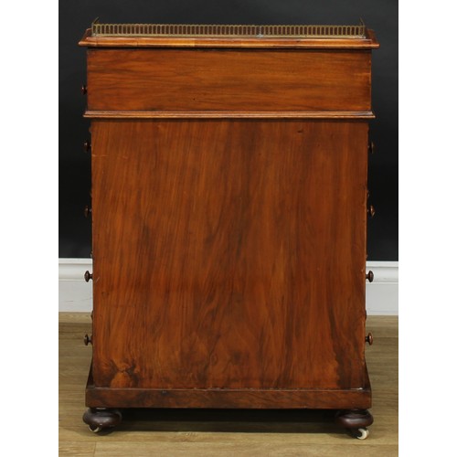 2288 - A Victorian walnut Davenport desk, brass three-quarter gallery, hinged sloping top with inset tooled... 