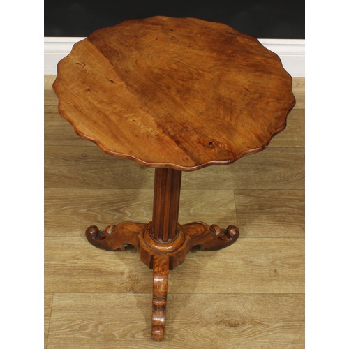 1640 - A 19th century walnut and satin birch tripod wine table, shaped circular top, fluted column, cabriol... 