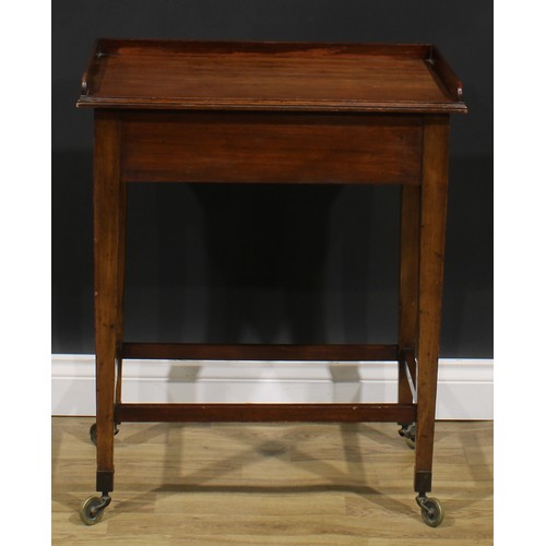 2480 - A George III Revival mahogany waiter’s trolley, three-quarter gallery above a deep frieze with drawe... 