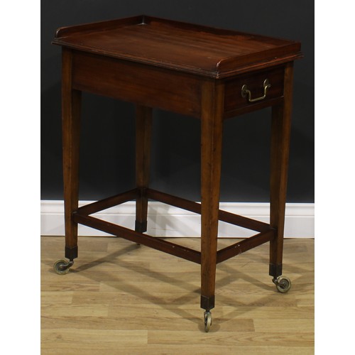 2480 - A George III Revival mahogany waiter’s trolley, three-quarter gallery above a deep frieze with drawe... 