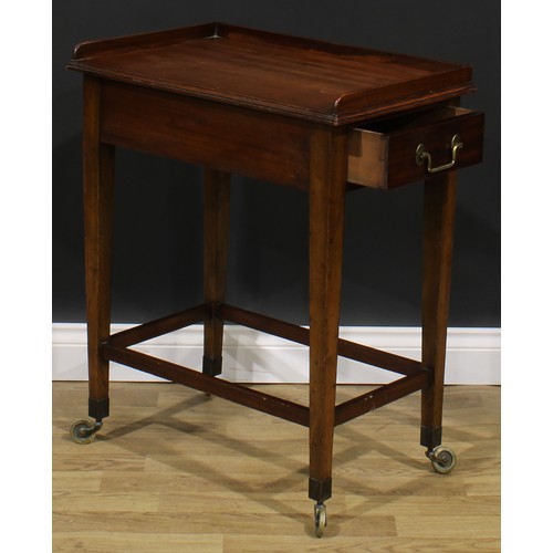 2480 - A George III Revival mahogany waiter’s trolley, three-quarter gallery above a deep frieze with drawe... 