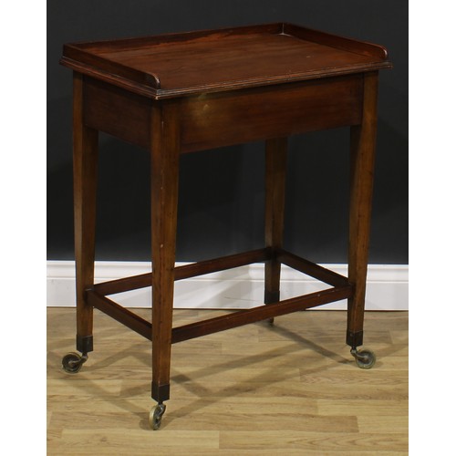 2480 - A George III Revival mahogany waiter’s trolley, three-quarter gallery above a deep frieze with drawe... 