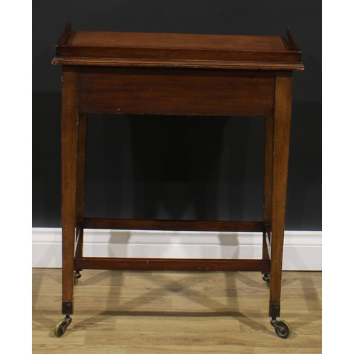 2480 - A George III Revival mahogany waiter’s trolley, three-quarter gallery above a deep frieze with drawe... 