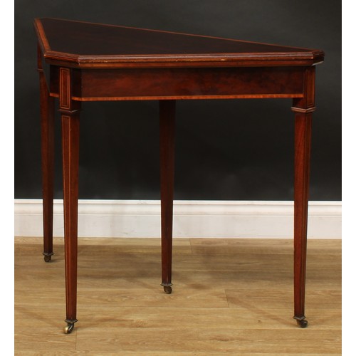 2063 - An unusual Sheraton Revival satinwood banded mahogany canted triform card table, hinged top enclosin... 