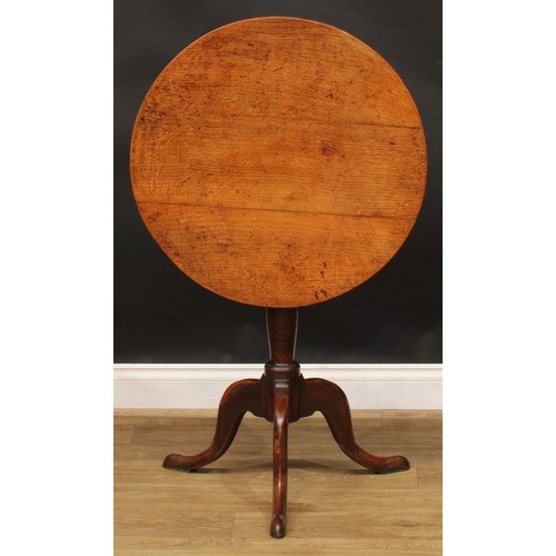 2044 - A George III vernacular oak tripod occasional table, possibly Welsh, circular tilting top, box-secti... 