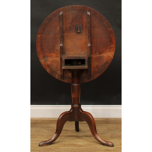 2044 - A George III vernacular oak tripod occasional table, possibly Welsh, circular tilting top, box-secti... 