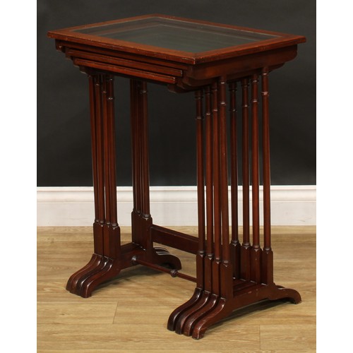 2373 - A set of Edwardian mahogany quartetto tables, each plateau with inset glass panel, outlined througho... 