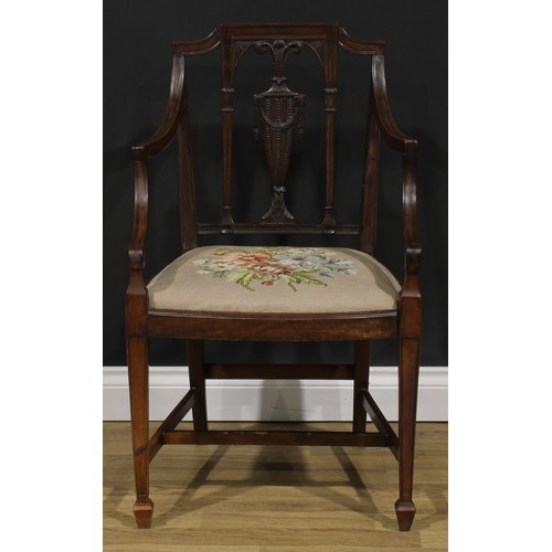 1798 - A George III mahogany Hepplewhite design elbow chair, 92.5cm high, 61cm wide, the seat 52.5cm wide a... 