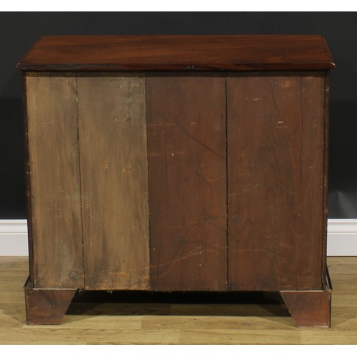 1740 - A George II Revival mahogany kneehole desk, rectangular top with reentrant foreangles above an arran... 