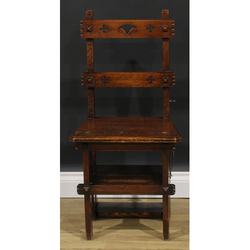 2654 - An Arts & Crafts oak metamorphic library step chair, rectangular cresting and mid rail pierced with ... 