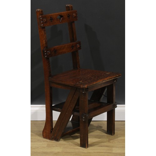 2654 - An Arts & Crafts oak metamorphic library step chair, rectangular cresting and mid rail pierced with ... 