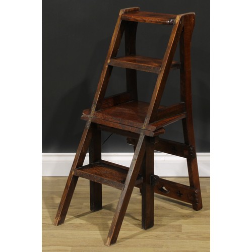 2654 - An Arts & Crafts oak metamorphic library step chair, rectangular cresting and mid rail pierced with ... 