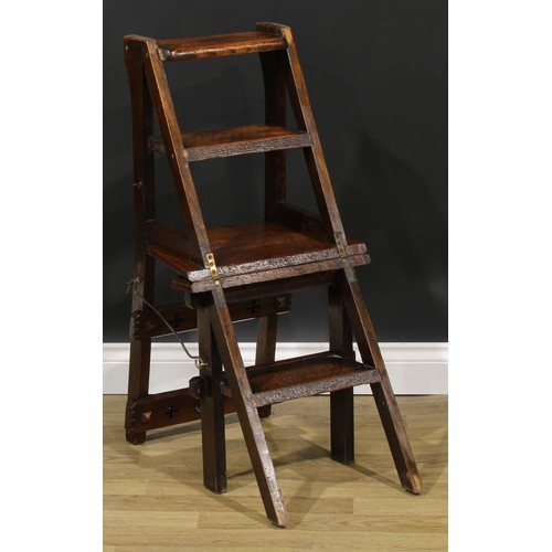 2654 - An Arts & Crafts oak metamorphic library step chair, rectangular cresting and mid rail pierced with ... 