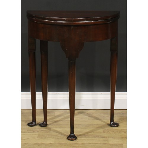 1738 - A George II Revival mahogany demilune tea table, of small proportions, hinged top above a deep friez... 