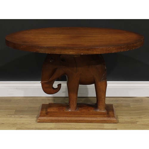 2643 - An Art Deco mahogany occasional table, oval top, the support carved as an elephant, stepped rectangu... 