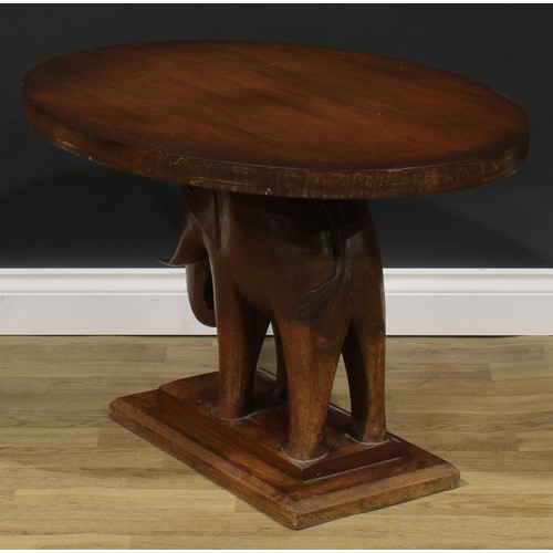 2643 - An Art Deco mahogany occasional table, oval top, the support carved as an elephant, stepped rectangu... 