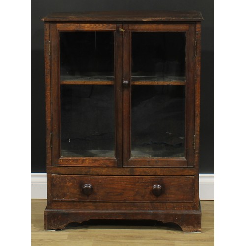 1712 - A 19th century oak study bookcase cabinet, of small proportions, rectangular top with moulded edge a... 