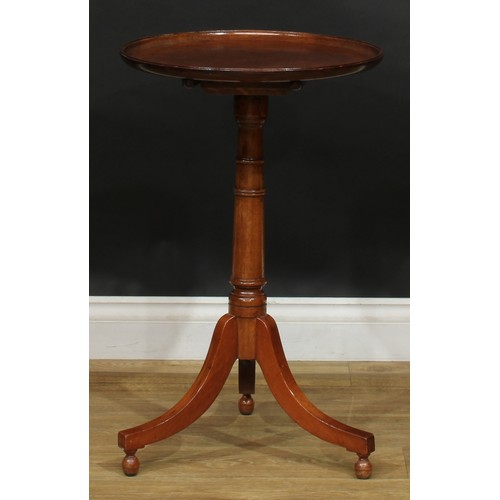 2479 - A George III Revival mahogany tripod wine table, dished circular tilting top, turned column, sabre l... 