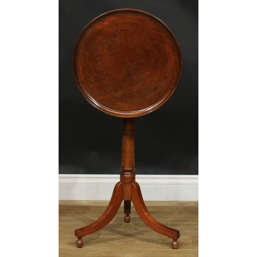 2479 - A George III Revival mahogany tripod wine table, dished circular tilting top, turned column, sabre l... 