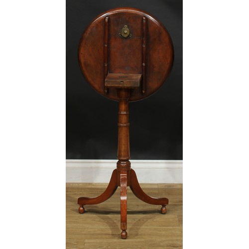 2479 - A George III Revival mahogany tripod wine table, dished circular tilting top, turned column, sabre l... 