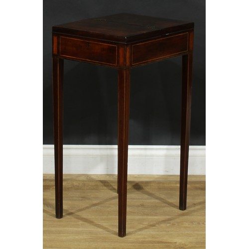 2038 - A George III rosewood and mahogany work table, flush top with crossbanded twin covers hinged to the ... 