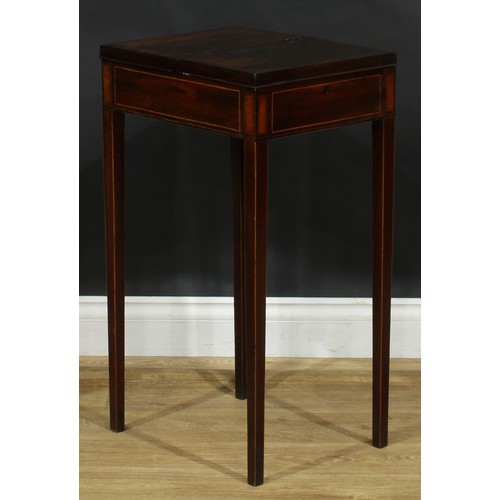 2038 - A George III rosewood and mahogany work table, flush top with crossbanded twin covers hinged to the ... 