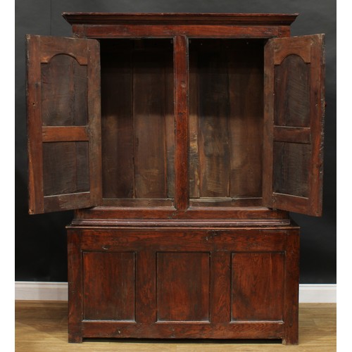 2665 - An early 18th century oak housekeeper’s livery or provision cupboard, inscribed HP and IR, moulded c... 