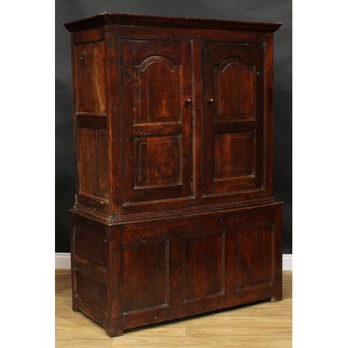 2665 - An early 18th century oak housekeeper’s livery or provision cupboard, inscribed HP and IR, moulded c... 