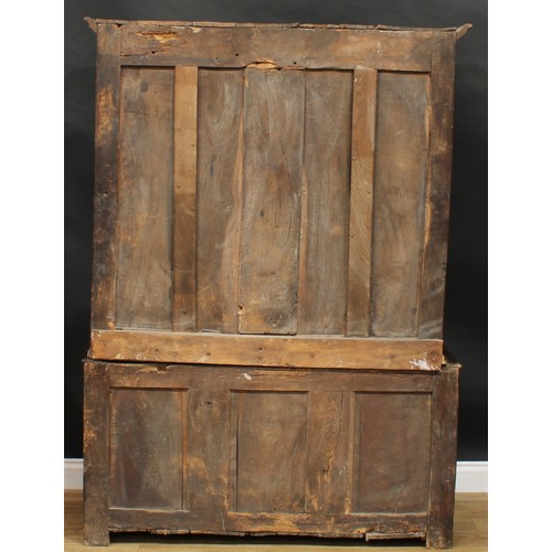 2665 - An early 18th century oak housekeeper’s livery or provision cupboard, inscribed HP and IR, moulded c... 