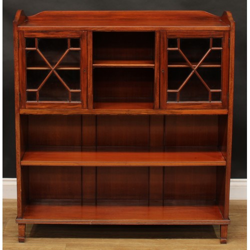 1877 - An Edwardian mahogany low library bookcase, shallow three-quarter gallery above an arrangement of sh... 