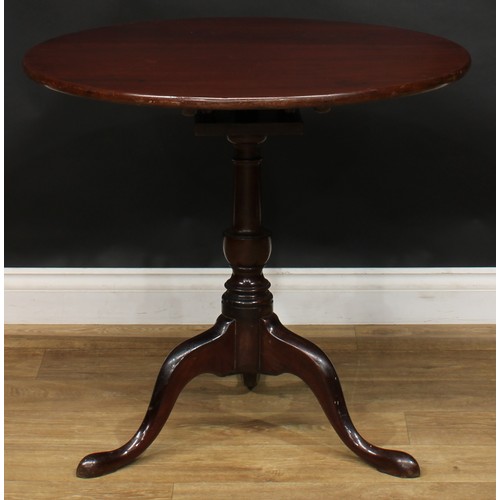 1938 - A George III mahogany tripod occasional table, one-piece circular tilting top, birdcage support, tur... 