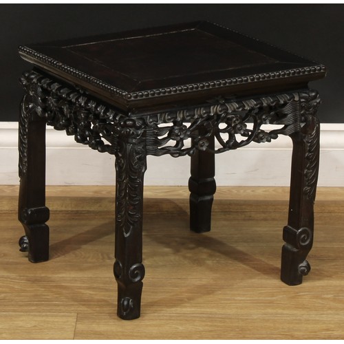 2027 - A Chinese hardwood jardiniere stand, square top with beaded edge, shaped apron pierced and carved wi... 