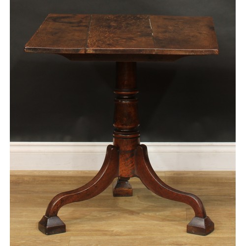 2123 - A George III oak tripod tavern table, rectangular tilting top, turned column, cabriole legs, block f... 