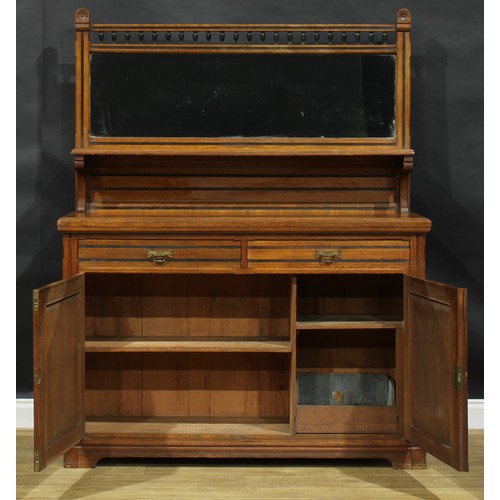 1841 - A late Victorian Aesthetic Movement oak side cabinet, spindle gallery flanked by domed finials carve... 