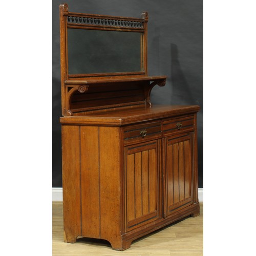 1841 - A late Victorian Aesthetic Movement oak side cabinet, spindle gallery flanked by domed finials carve... 