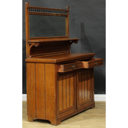 1841 - A late Victorian Aesthetic Movement oak side cabinet, spindle gallery flanked by domed finials carve... 