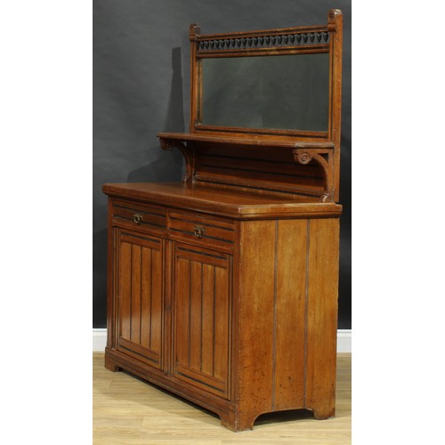 1841 - A late Victorian Aesthetic Movement oak side cabinet, spindle gallery flanked by domed finials carve... 