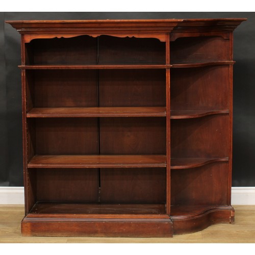 2400 - An unusual early 20th century open bookcase, oversailing top with moulded edge above open shelves an... 