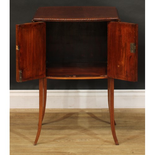 1879 - An Edwardian mahogany Pembroke-form bedroom cabinet, oval top with fall leaves above a pair of satin... 